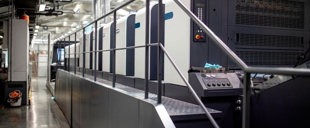 Large industrial printing machine in a modern printing facility